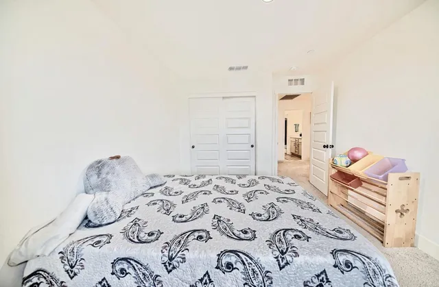 a front view of a house with a yard and porch