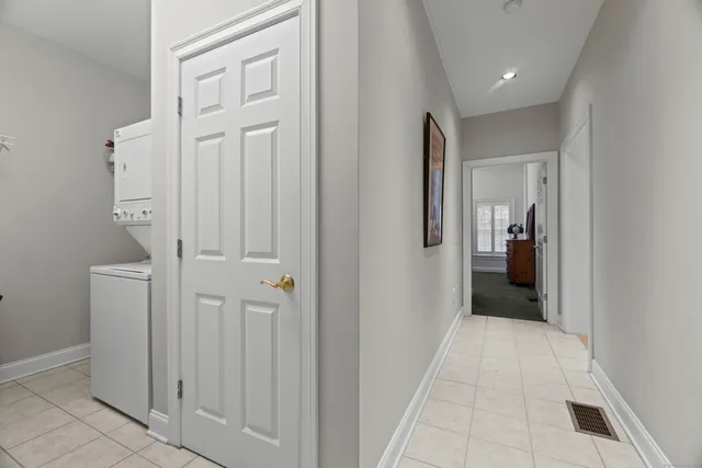 a view of a hallway with wooden shelves