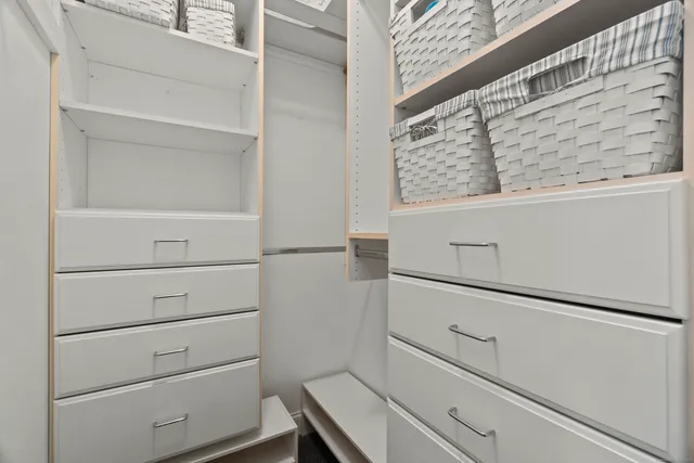 a view of a hallway with closet and a livingroom view