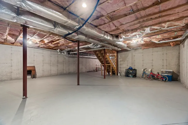 a view of a lake with a cars parked