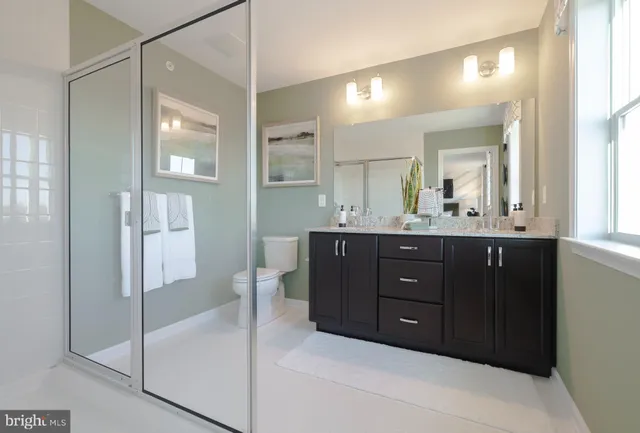 a bedroom with a bed and a wall painting