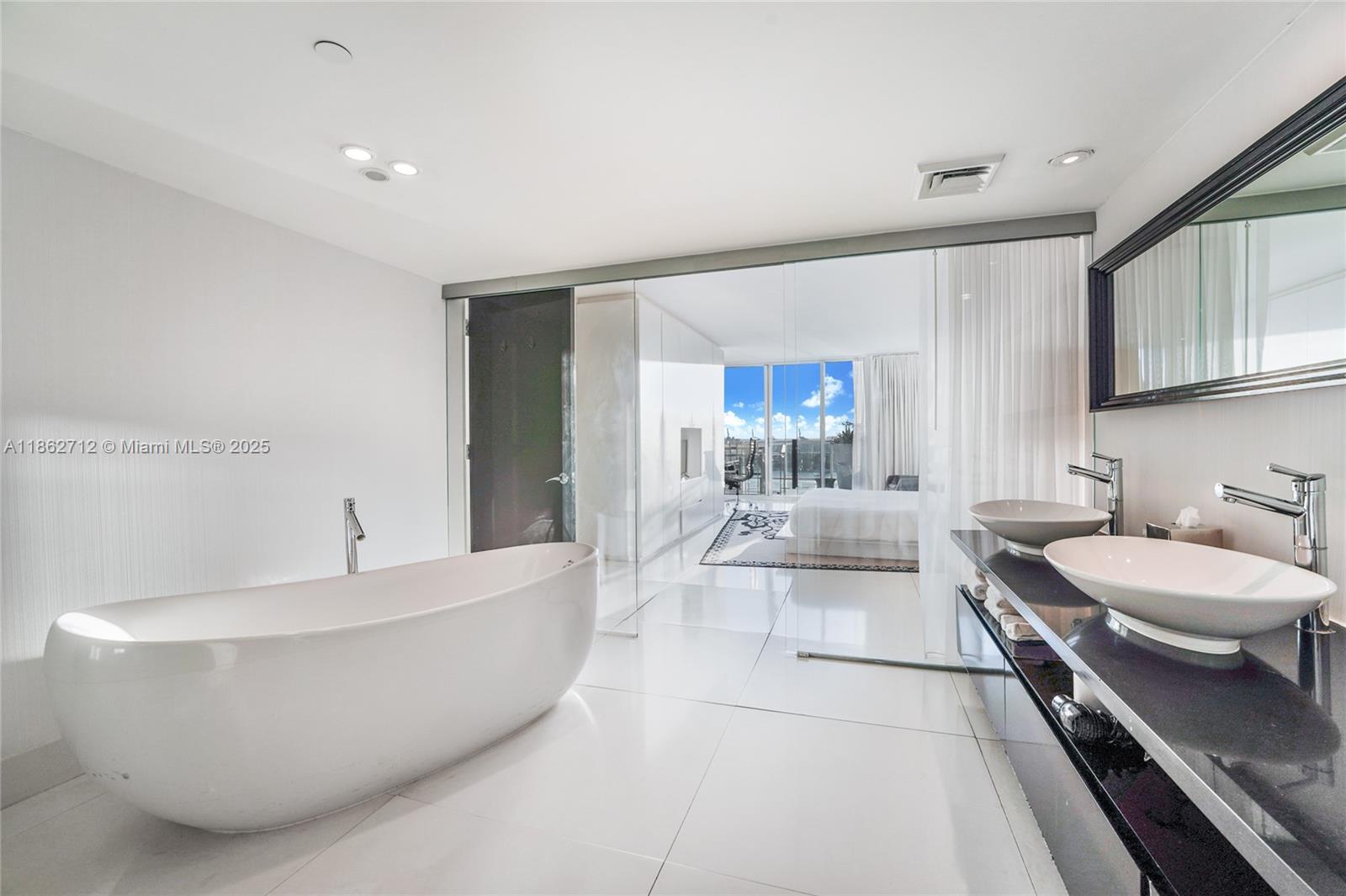 1100 West Avenue, Unit TS4 Miami Beach, FL 33139 - Photo 12 of 18 a spacious bathroom with a bathtub and a sink
