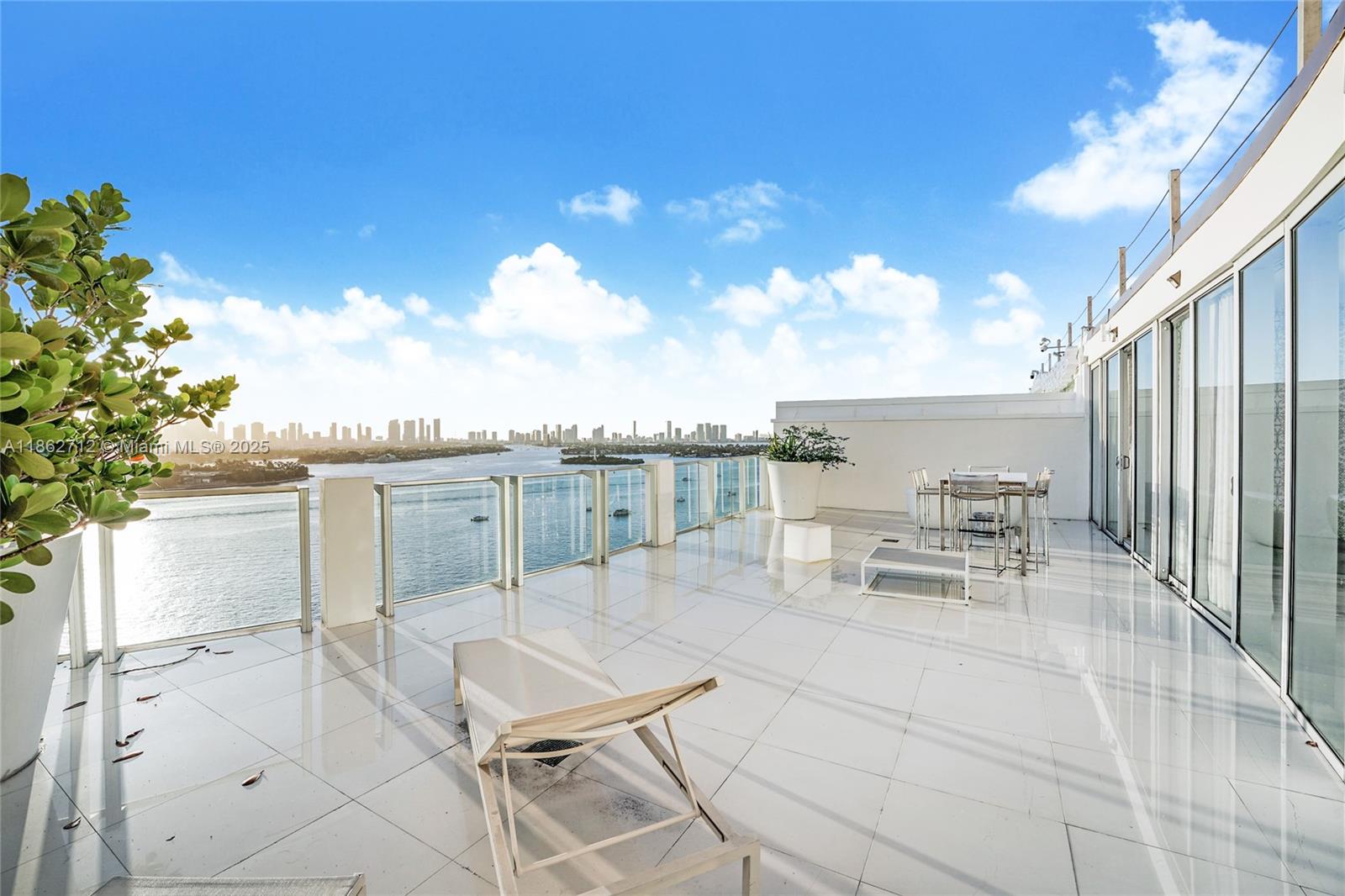 1100 West Avenue, Unit TS4 Miami Beach, FL 33139 - Photo 2 of 18 a view of a terrace with chairs