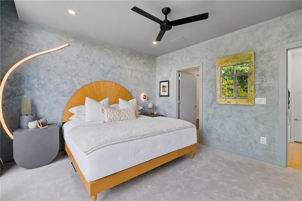 752 Moreland Avenue Southeast, Unit 4 Atlanta, GA 30316 - Photo 29 of 58 a bedroom with a bed and a painting on the wall