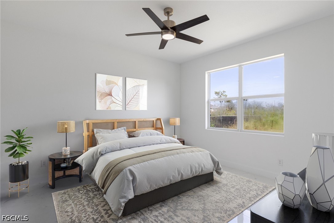 3418 14th Street Southwest Lehigh Acres, FL 33976 - Photo 13 of 24 a bedroom with a bed and painting on the wall