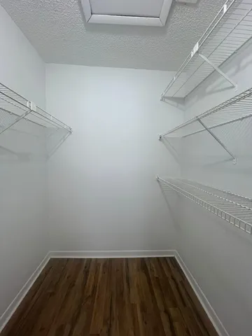 a view of a room with racks on the wall