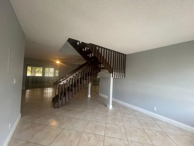a hallway with chandelier