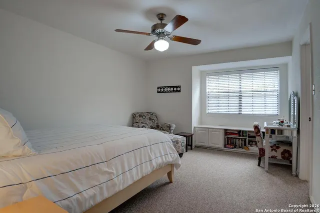 a bed room with a bed and a window