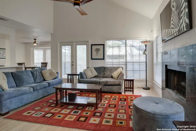 a living room with furniture and a fireplace