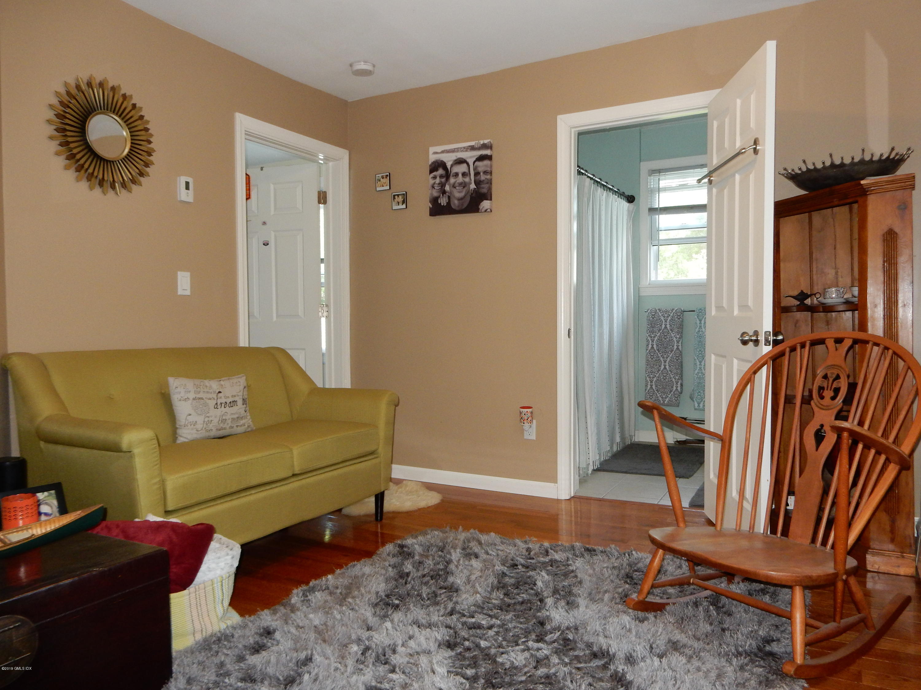26 Valley Road, Unit B Cos Cob, CT 06807 - Photo 5 of 9 a view of a livingroom with furniture and windows
