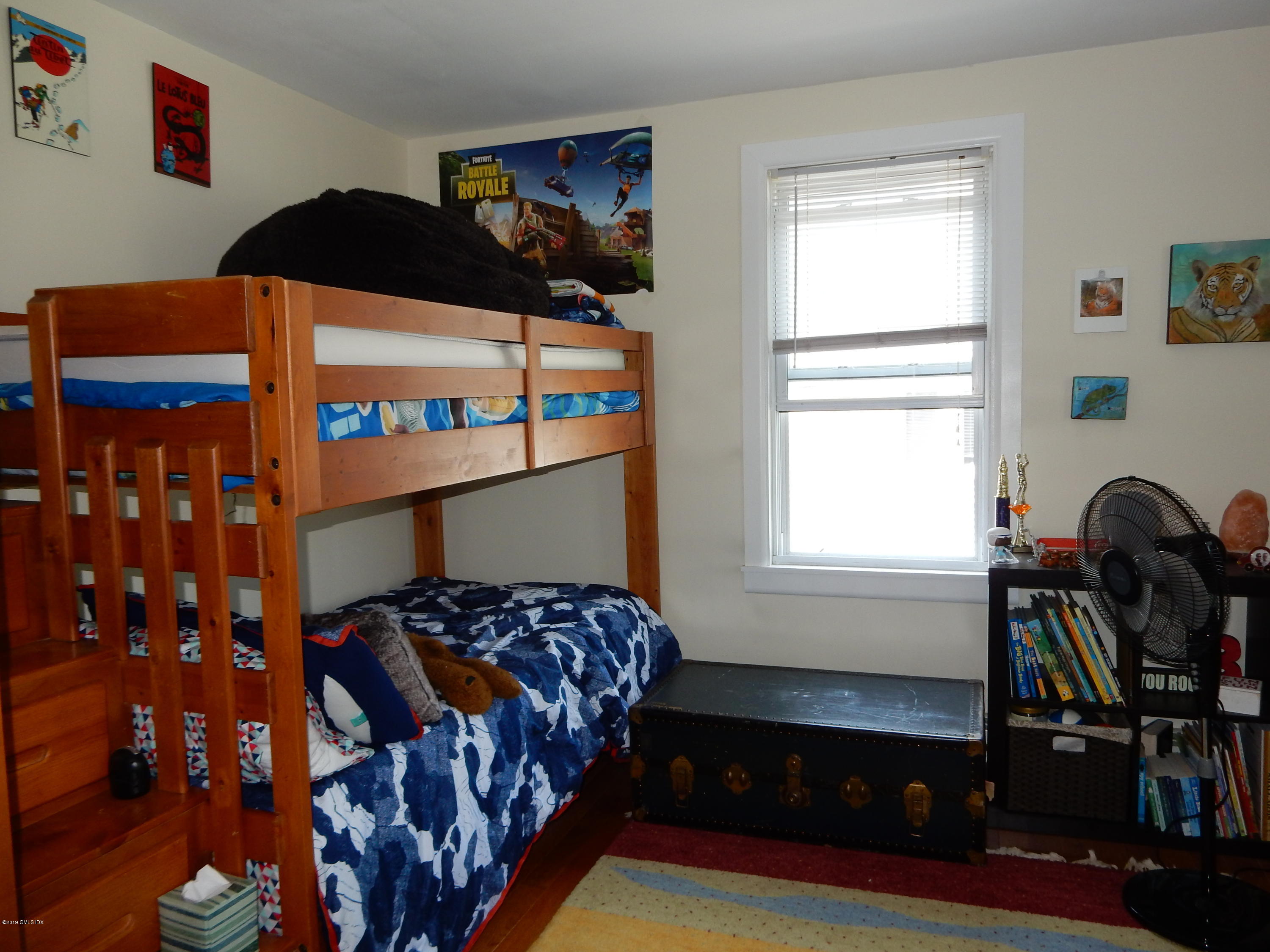 26 Valley Road, Unit B Cos Cob, CT 06807 - Photo 8 of 9 a bedroom with a bed and a window