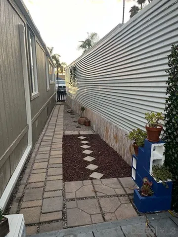 a bathroom with a sink and potted plants