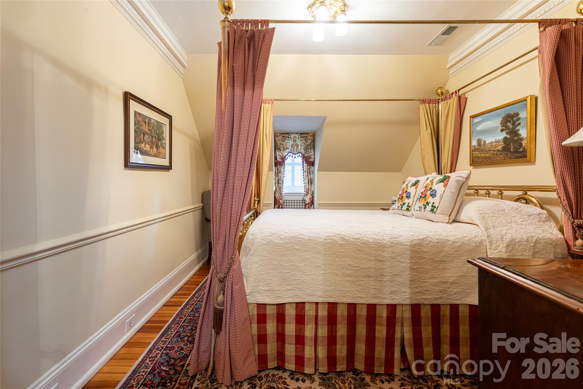 324 Vanderbilt Road Asheville, NC 28803 - Photo 35 of 48 a bedroom with a bed and wooden floor