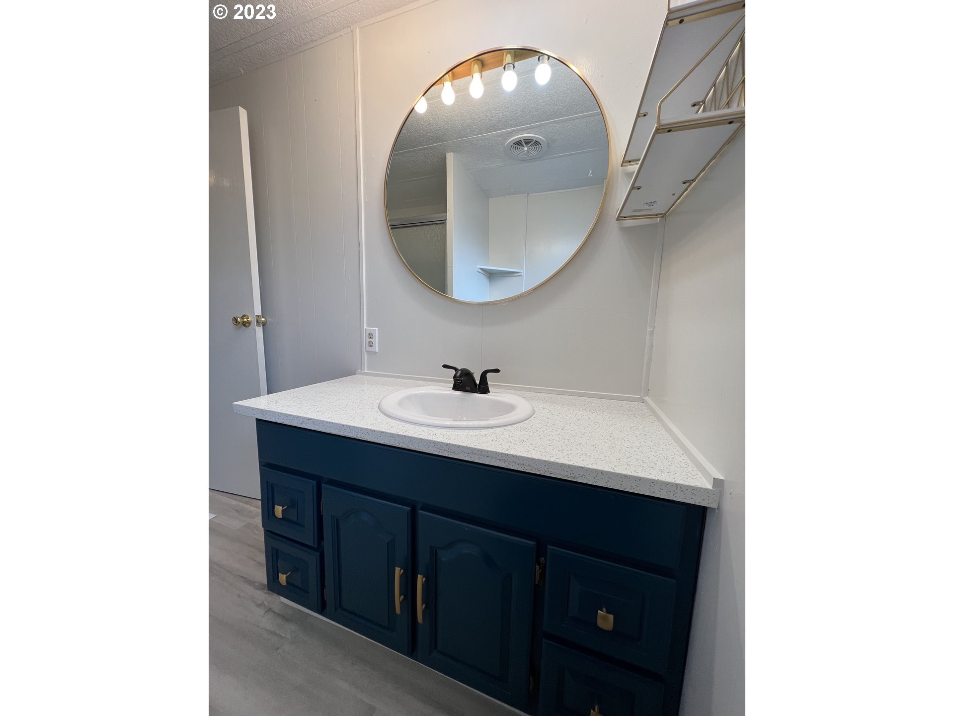 16745 Southeast Division Street, Unit 290 Portland, OR 97236 - Photo 14 of 22 a bathroom with a sink and a mirror