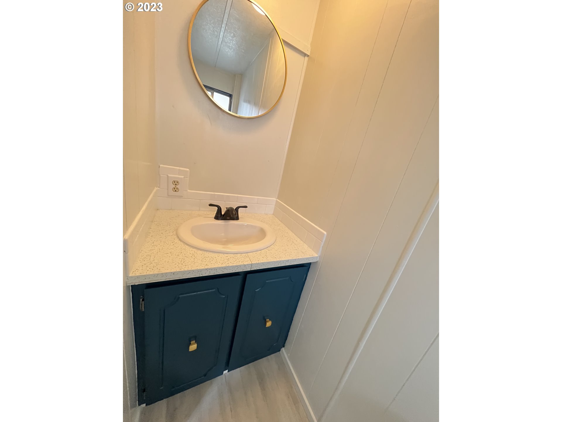 16745 Southeast Division Street, Unit 290 Portland, OR 97236 - Photo 15 of 22 a bathroom with a sink and a mirror