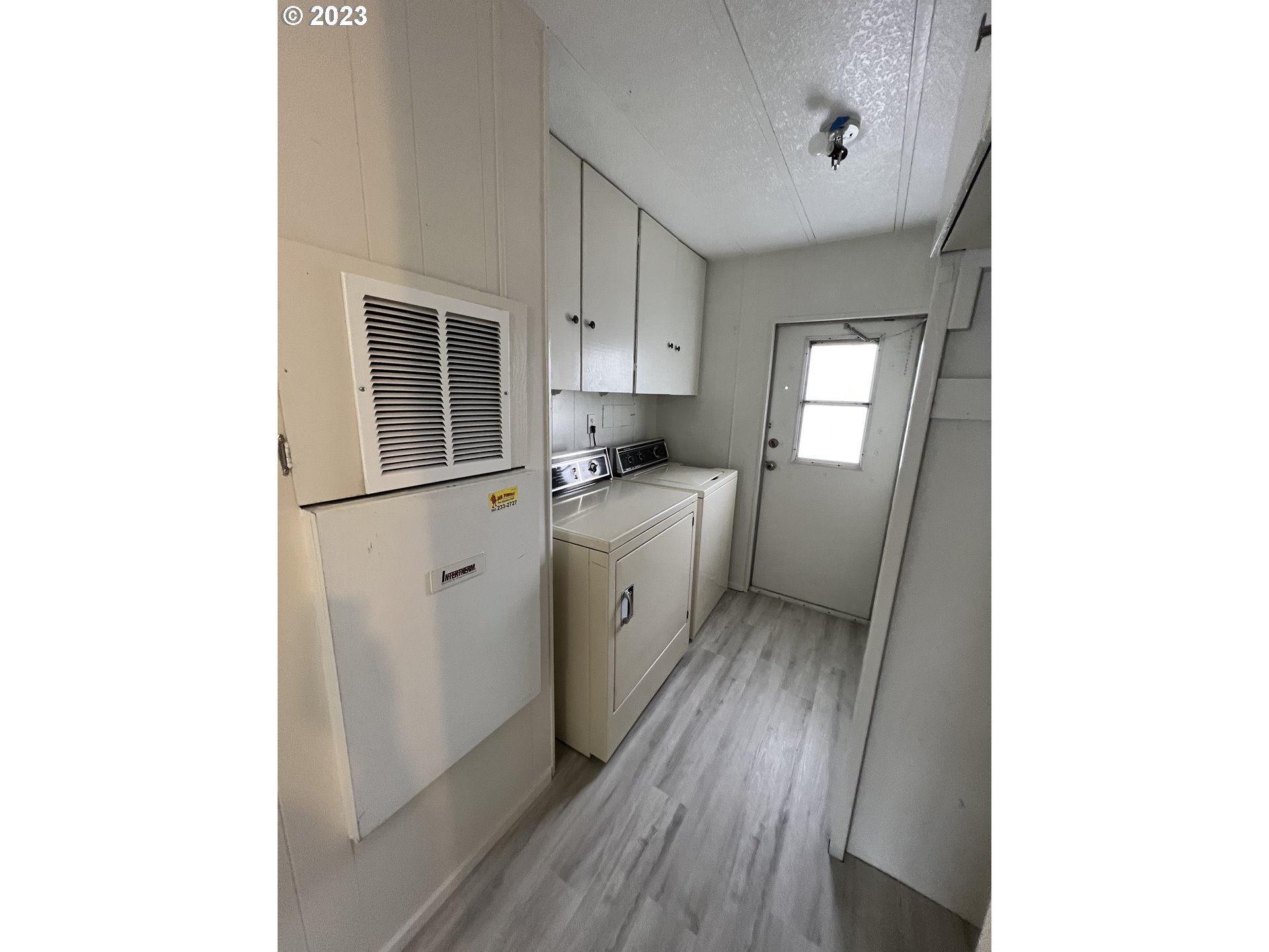 16745 Southeast Division Street, Unit 290 Portland, OR 97236 - Photo 20 of 22 a kitchen with a sink a window and cabinets