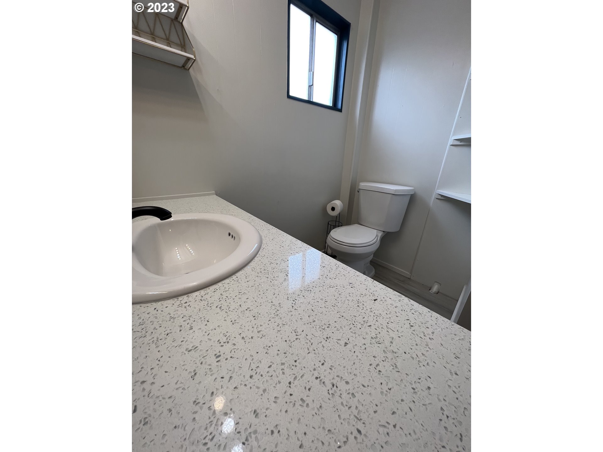 16745 Southeast Division Street, Unit 290 Portland, OR 97236 - Photo 21 of 22 a bathroom with a sink and toilet