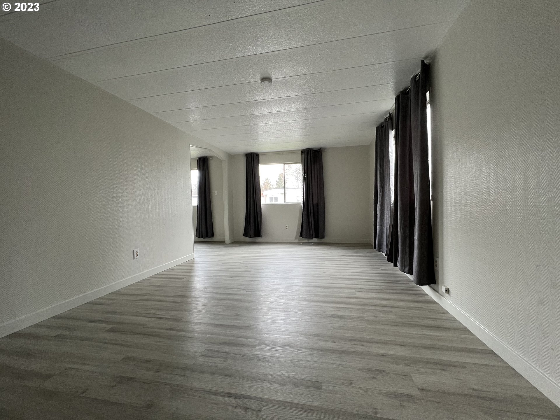 16745 Southeast Division Street, Unit 290 Portland, OR 97236 - Photo 4 of 22 a view of livingroom and window