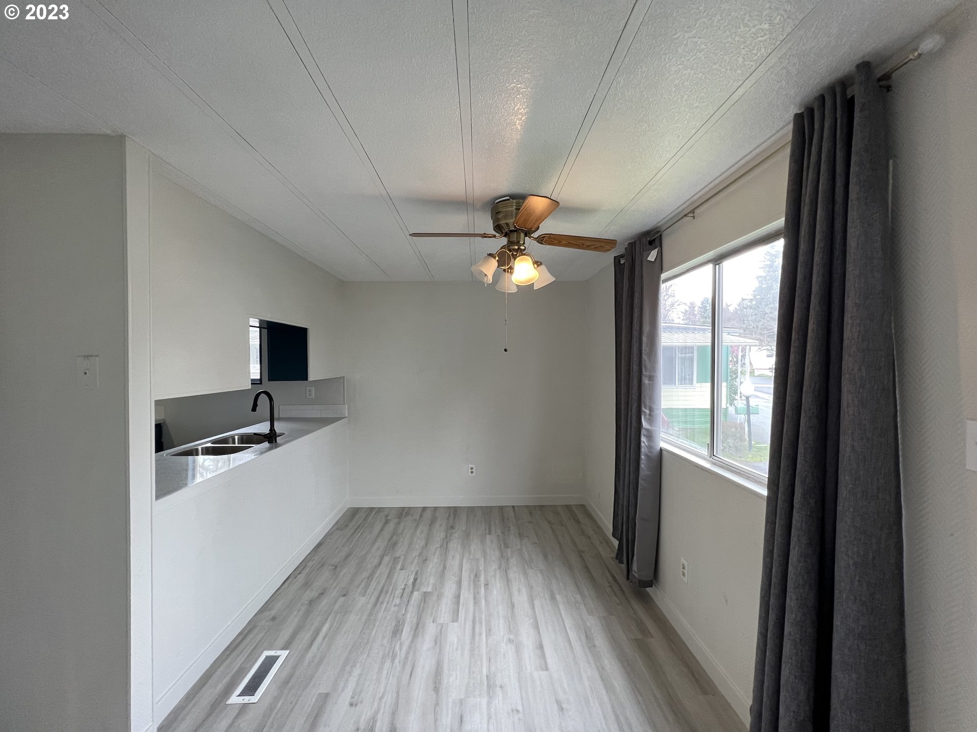 16745 Southeast Division Street, Unit 290 Portland, OR 97236 - Photo 8 of 22 a view of a livingroom with a flat screen tv