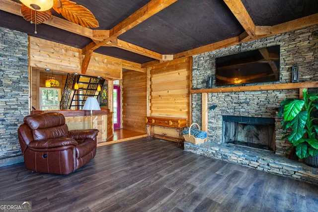 a living room with furniture fireplace and flat screen tv