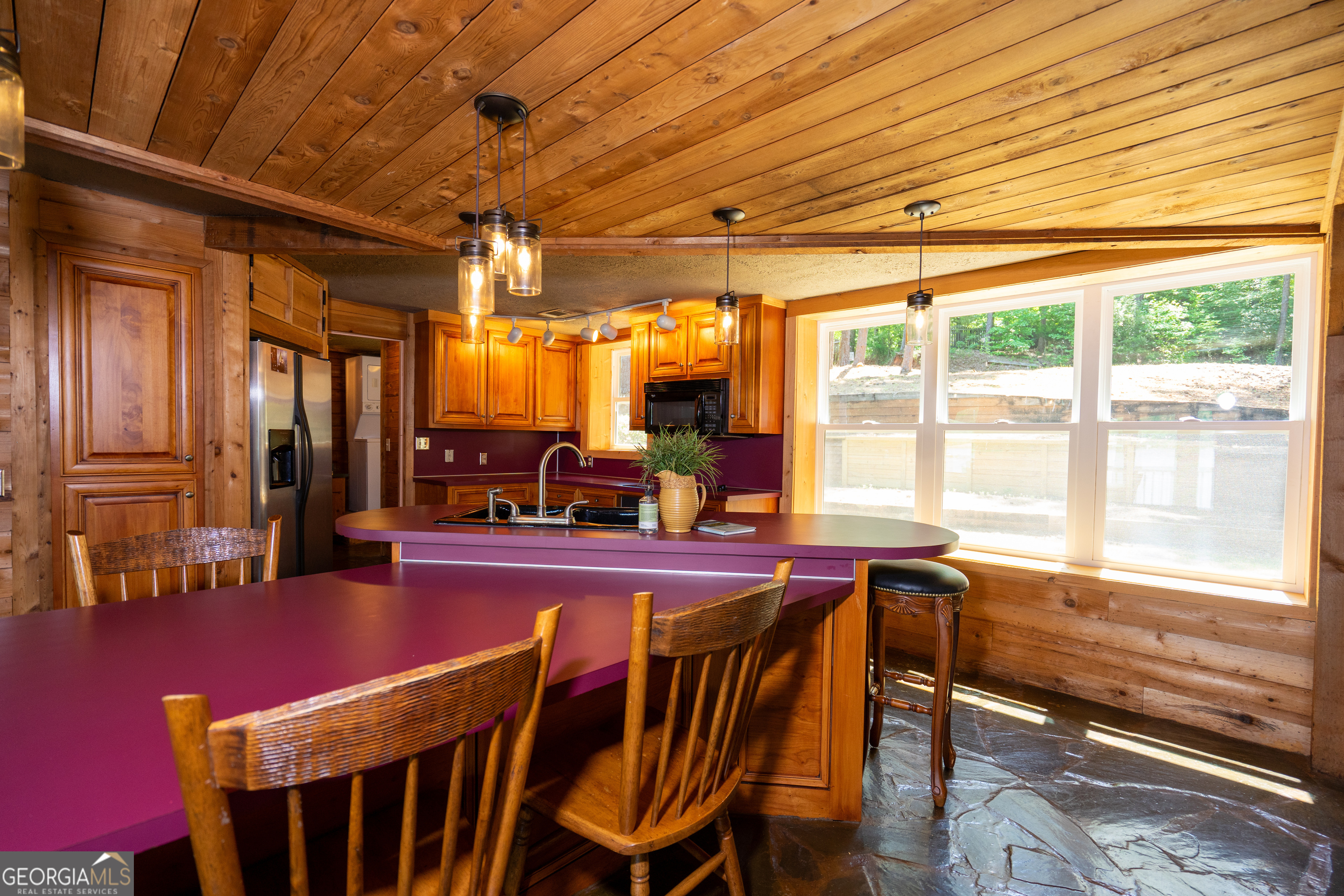 230 Kelly Drive Hamilton, GA 31811 - Photo 17 of 53 a view of a dining room with furniture a chandelier and wooden floor
