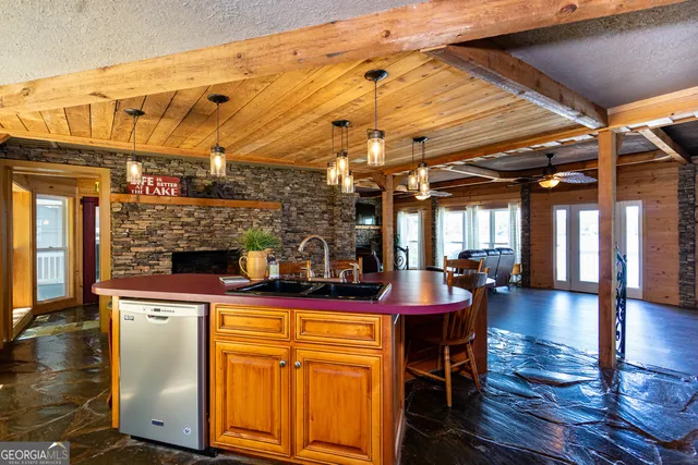 a view of a dining room with furniture wooden floor and chandelier