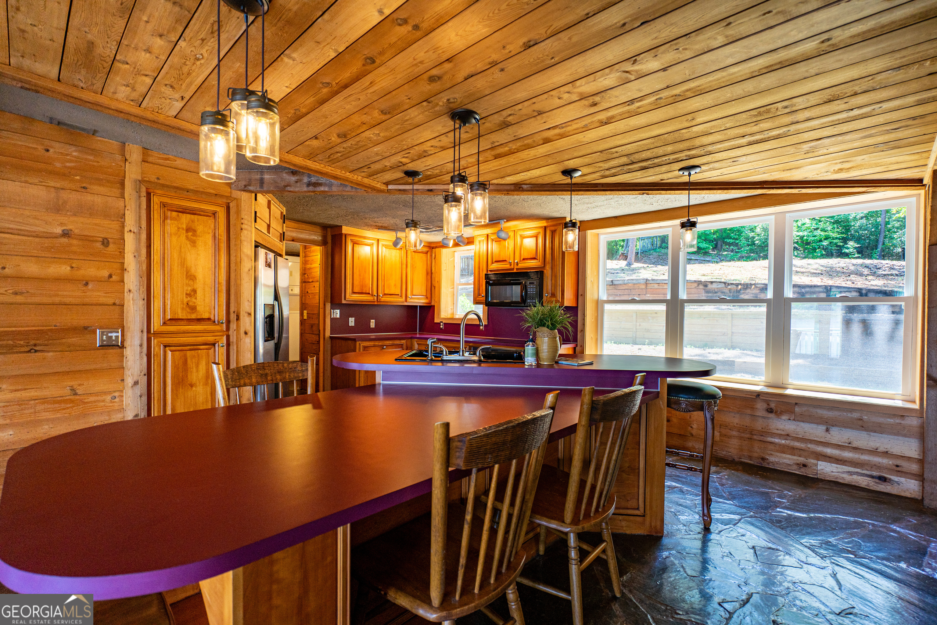 230 Kelly Drive Hamilton, GA 31811 - Photo 19 of 53 a view of a dining room with furniture wooden floor and chandelier