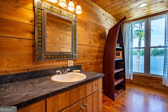 a bathroom with a toilet a sink and shower