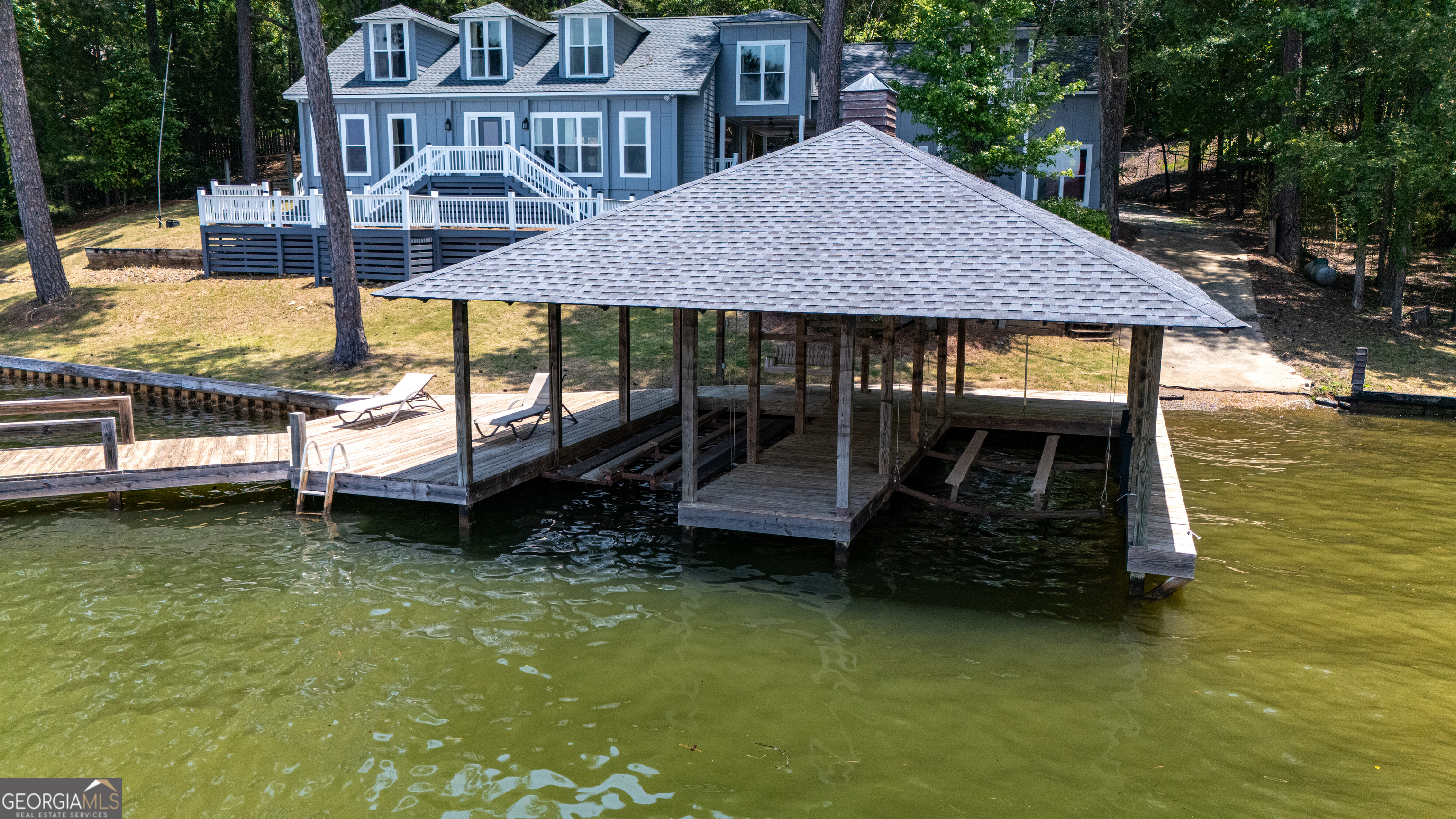 230 Kelly Drive Hamilton, GA 31811 - Photo 3 of 53 a backyard of a house with yard table and chairs