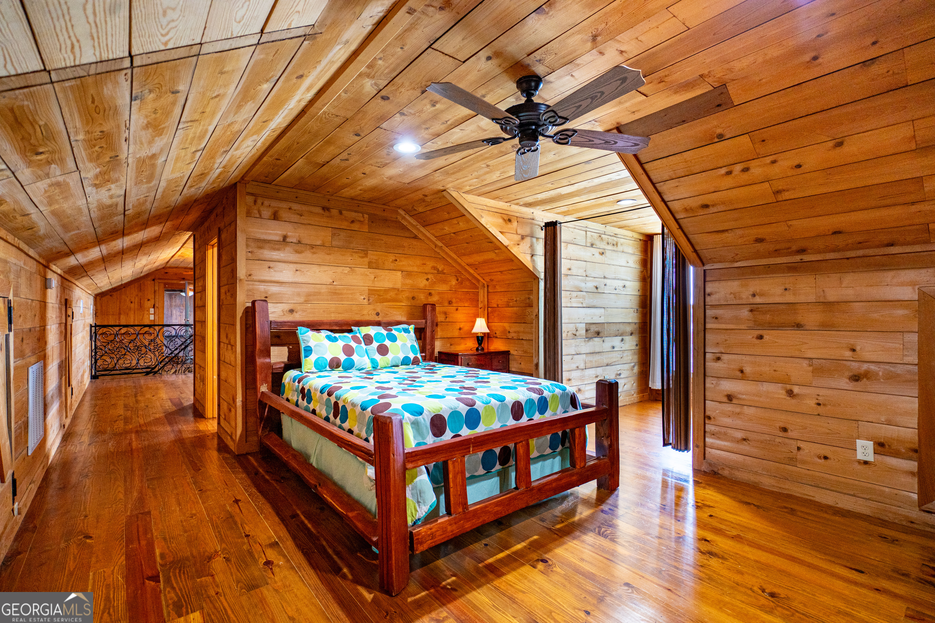 230 Kelly Drive Hamilton, GA 31811 - Photo 31 of 53 a bedroom with a bed and wooden floor