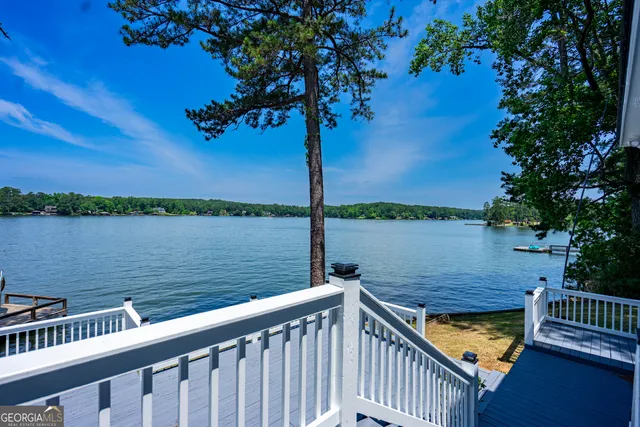 a view of a terrace with wooden floor and fence