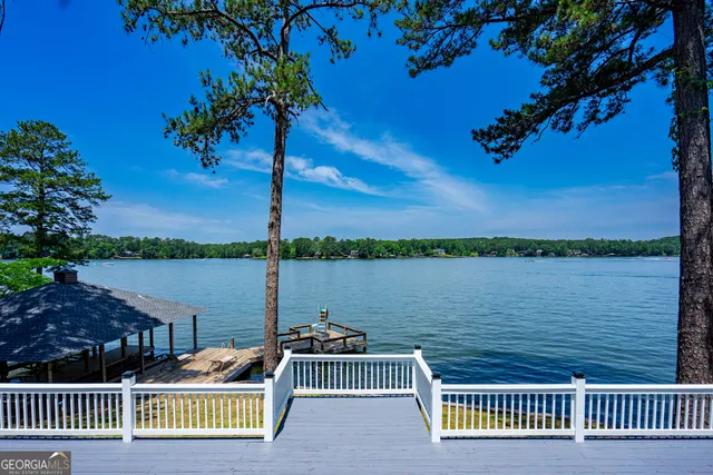 a view of a lake with outdoor seating