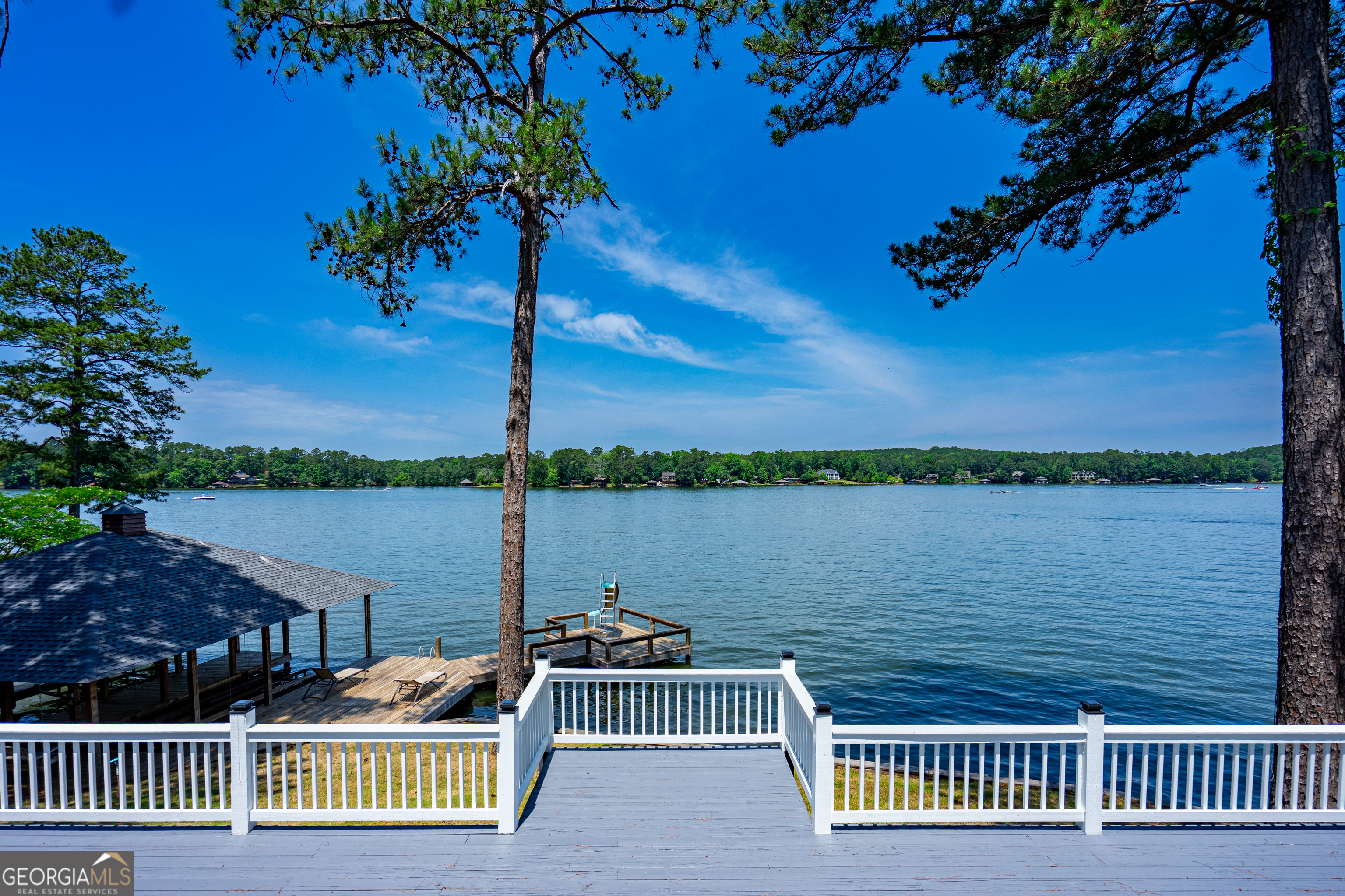 230 Kelly Drive Hamilton, GA 31811 - Photo 39 of 53 a view of a balcony with two chairs and a table