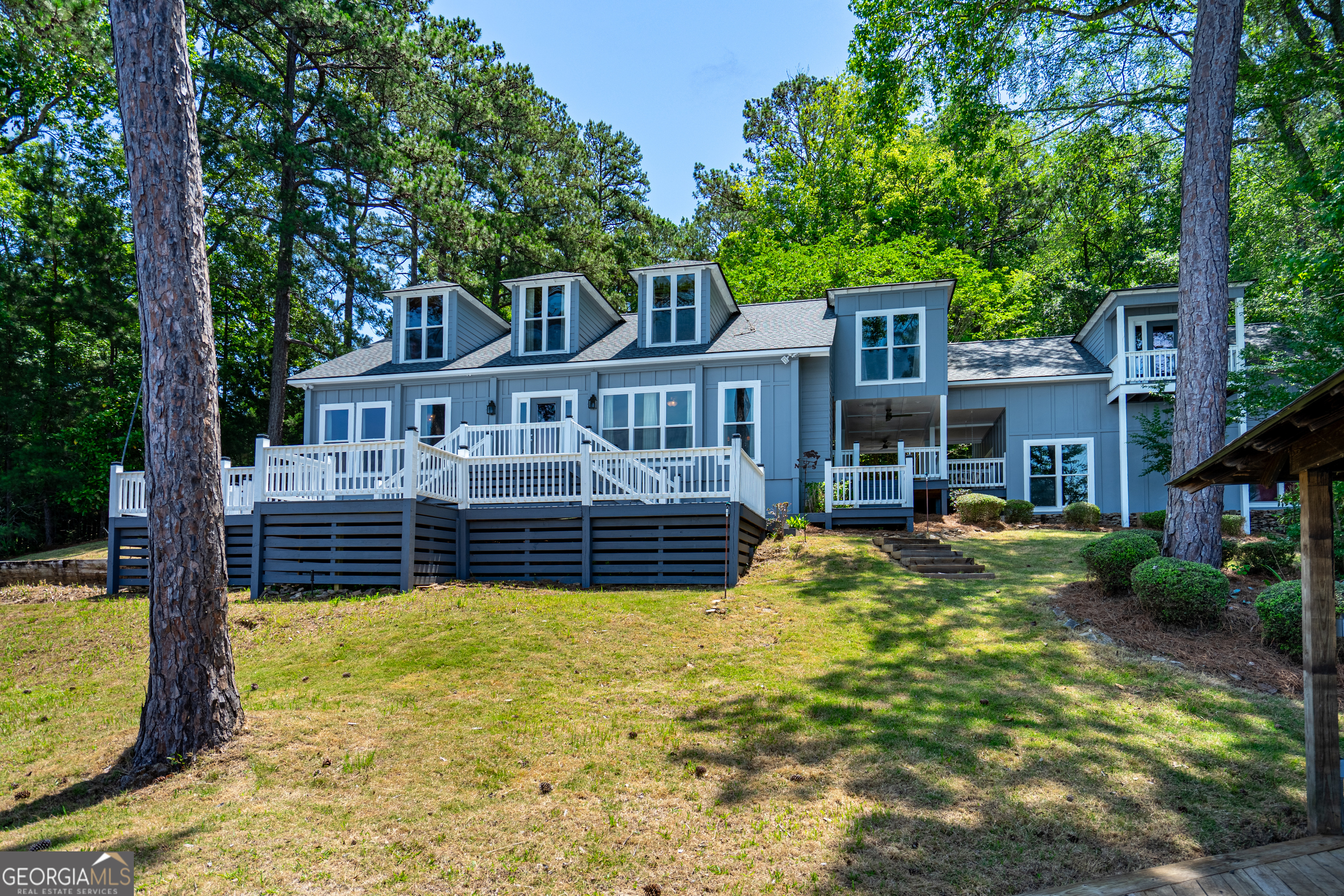 230 Kelly Drive Hamilton, GA 31811 - Photo 4 of 53 a view of a house with swimming pool and sitting area