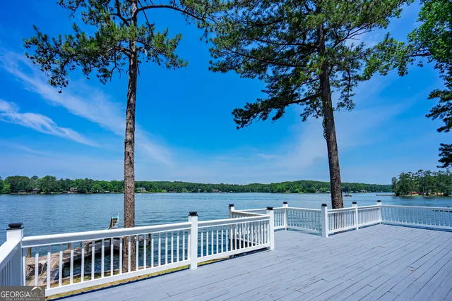 a view of a backyard with swimming pool