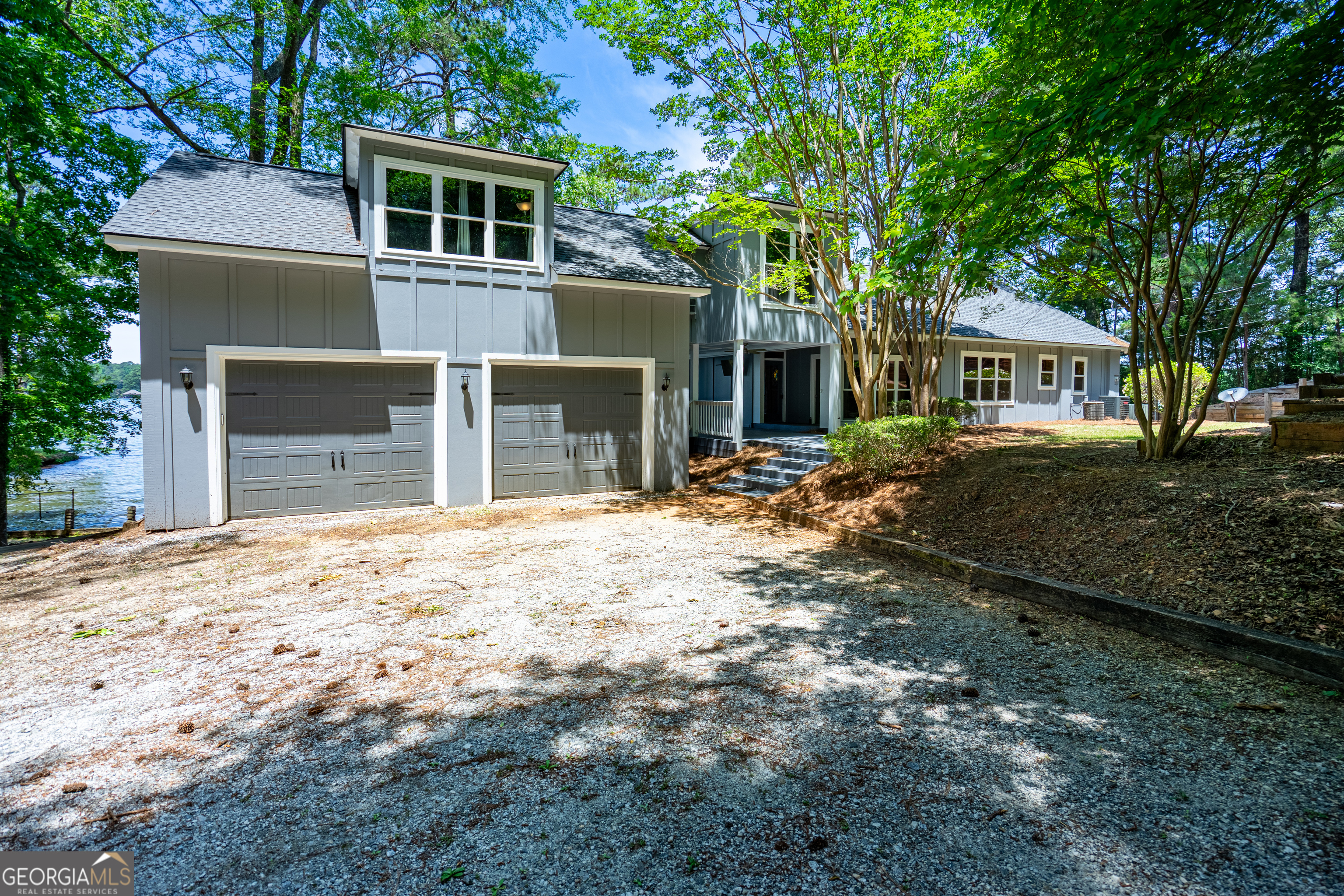 230 Kelly Drive Hamilton, GA 31811 - Photo 8 of 53 a front view of a house with a yard and a garage