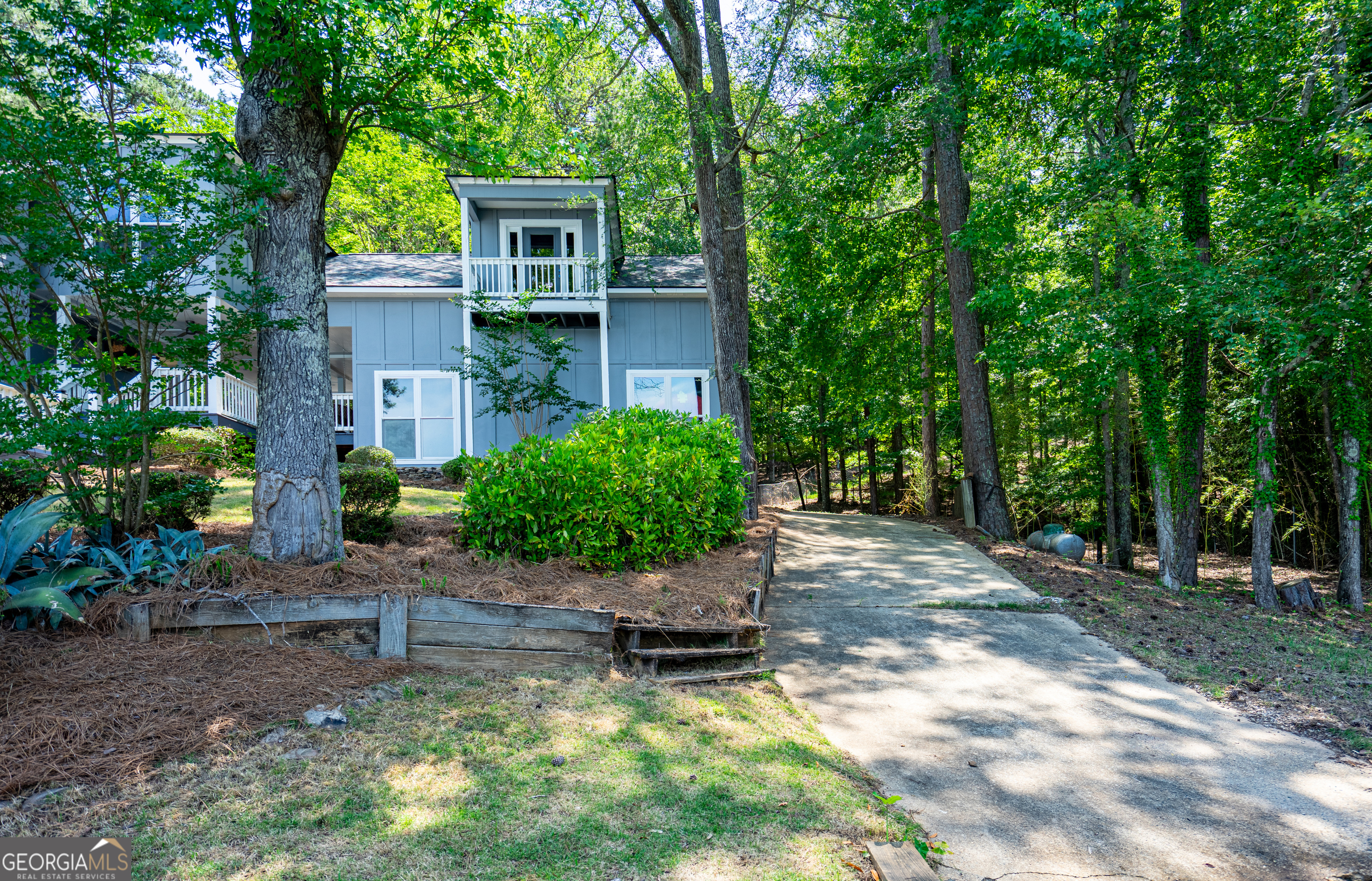 230 Kelly Drive Hamilton, GA 31811 - Photo 9 of 53 a house with a tree in front of it