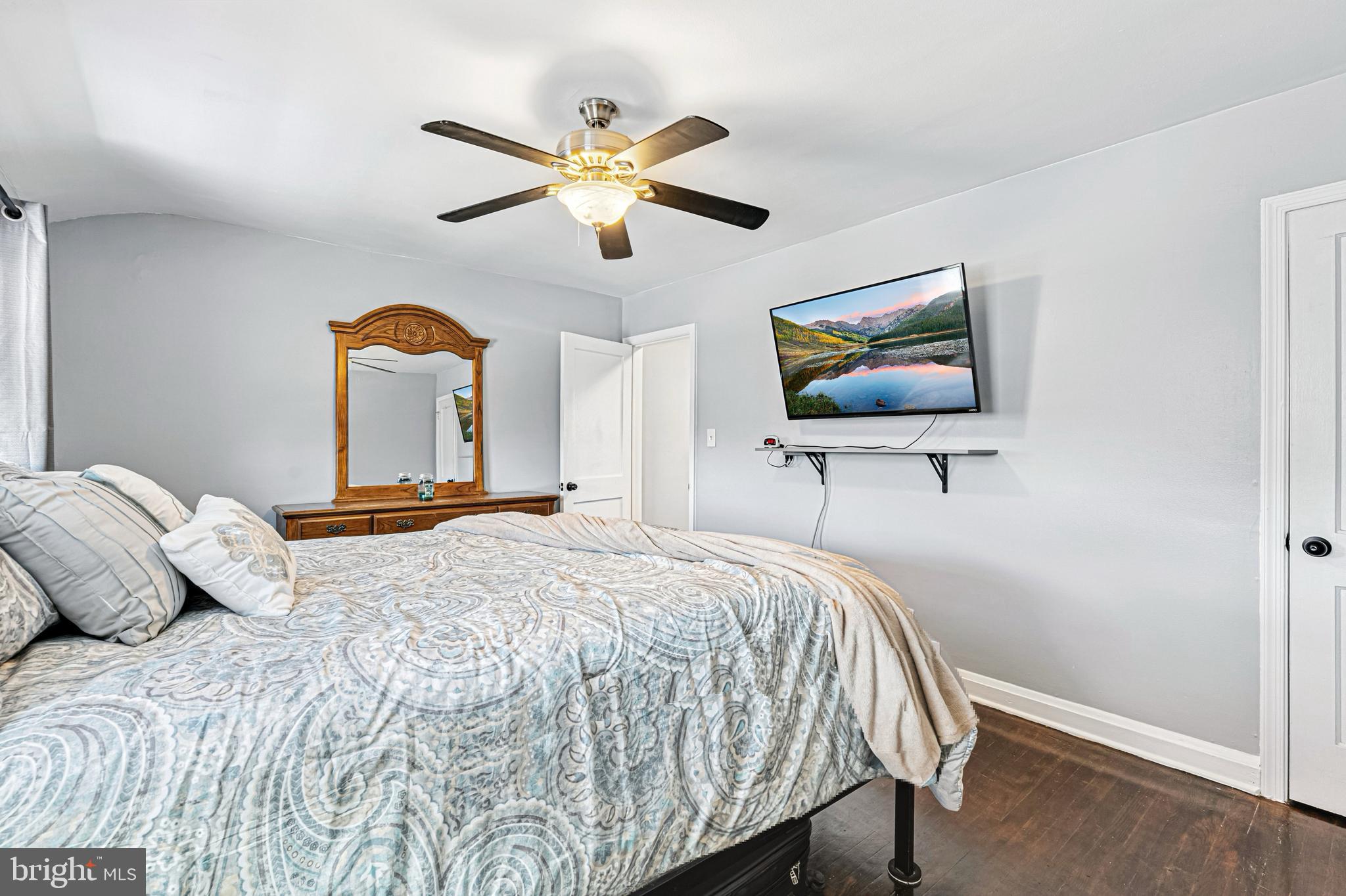 8272 Kavanagh Road Baltimore, MD 21222 - Photo 15 of 29 a bedroom with a bed and a flat screen tv