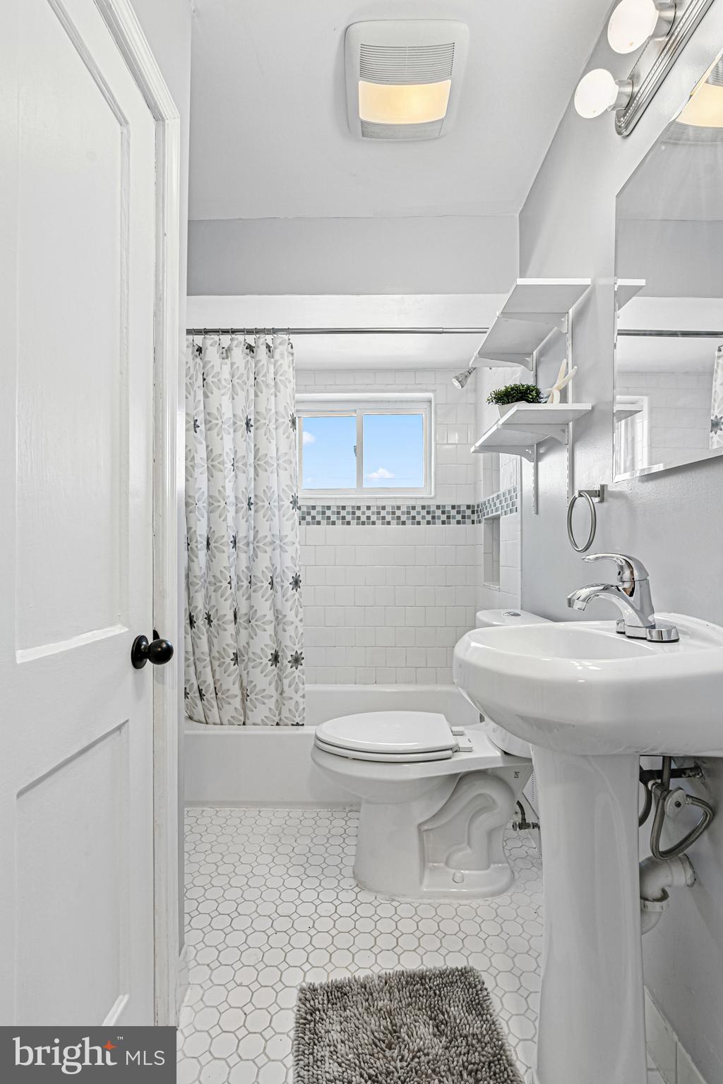 8272 Kavanagh Road Baltimore, MD 21222 - Photo 17 of 29 a bathroom with a sink toilet and shower