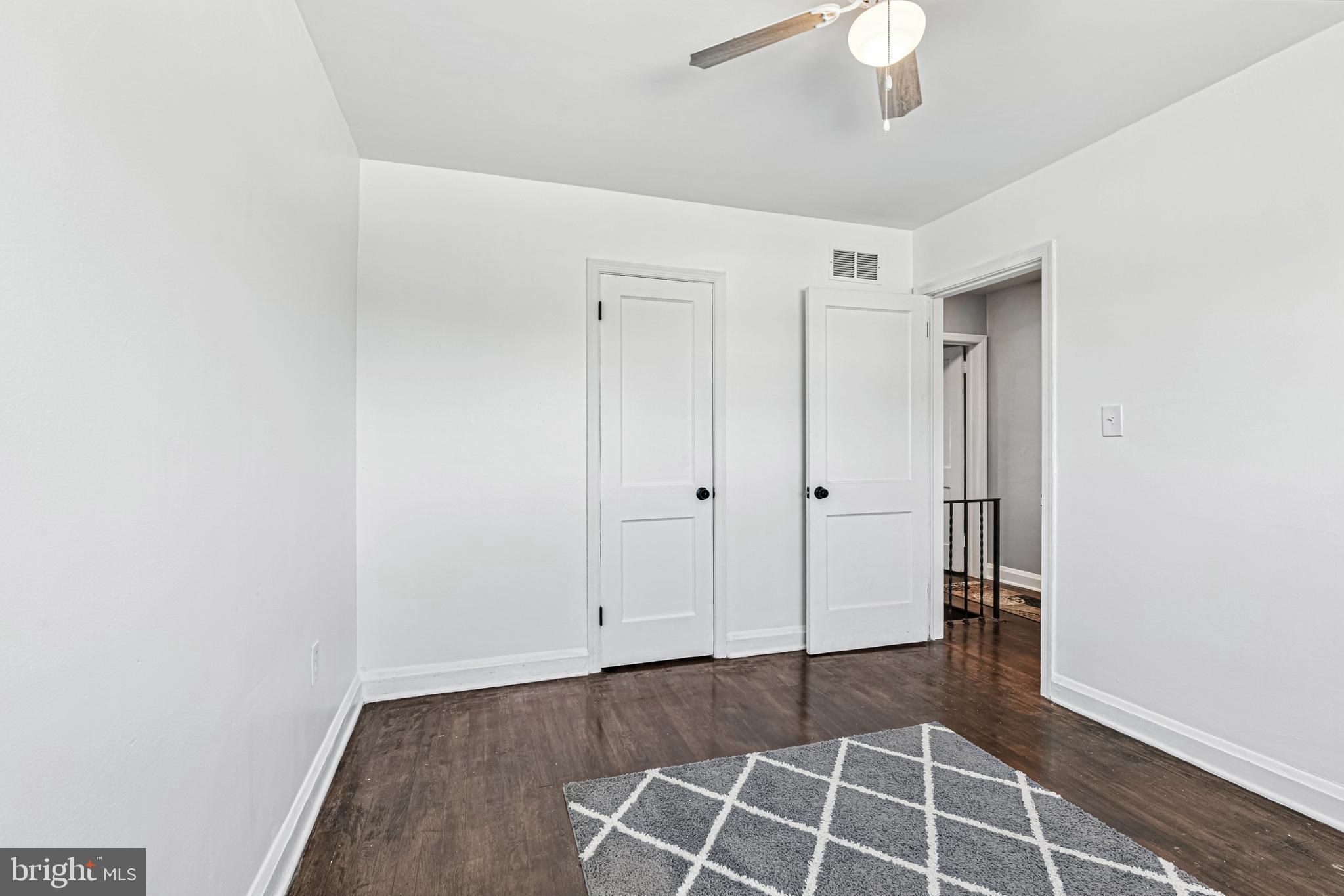8272 Kavanagh Road Baltimore, MD 21222 - Photo 19 of 29 a view of an empty room with wooden floor