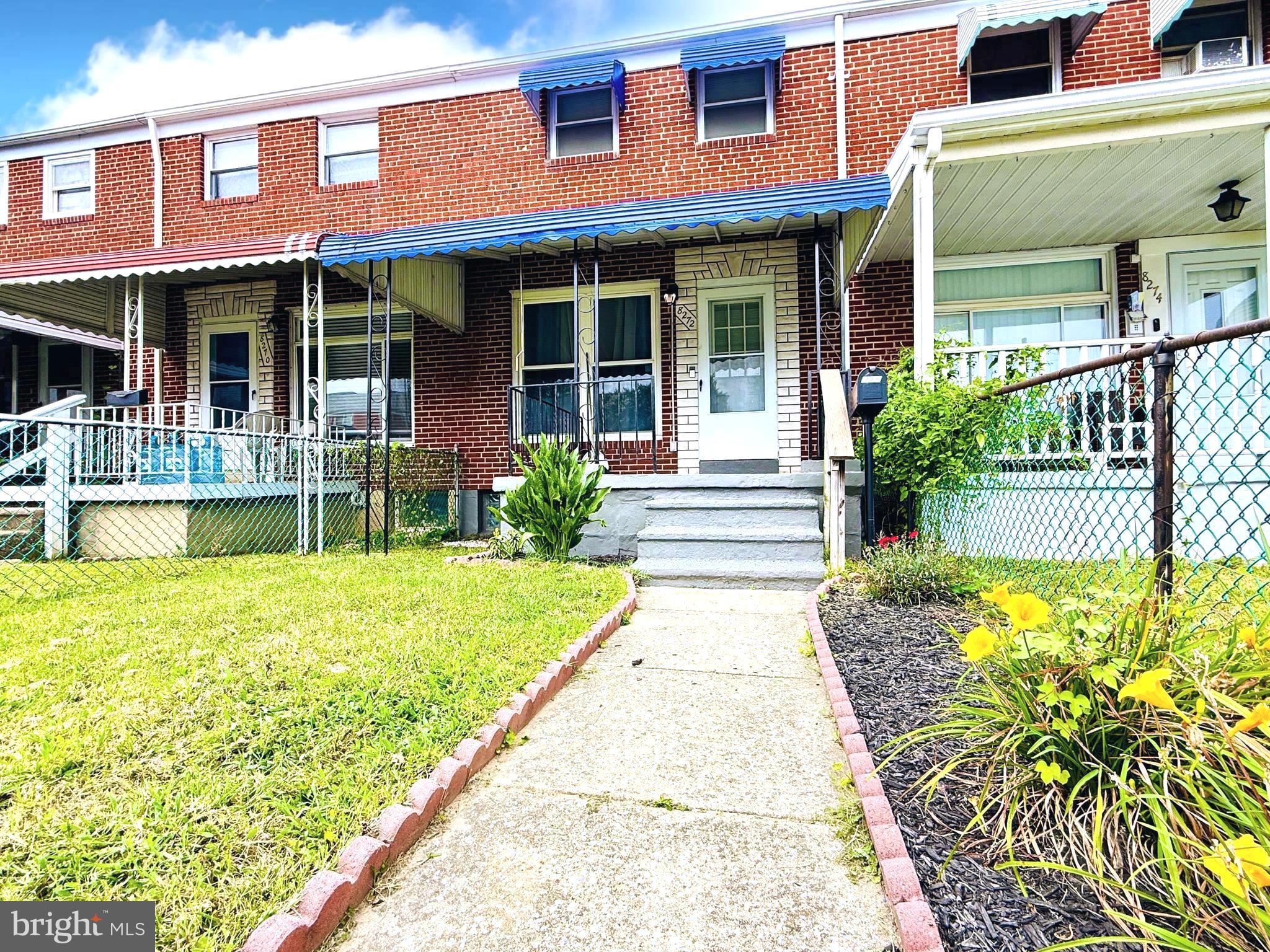 8272 Kavanagh Road Baltimore, MD 21222 - Photo 3 of 29 a front view of a house with a yard table and chairs