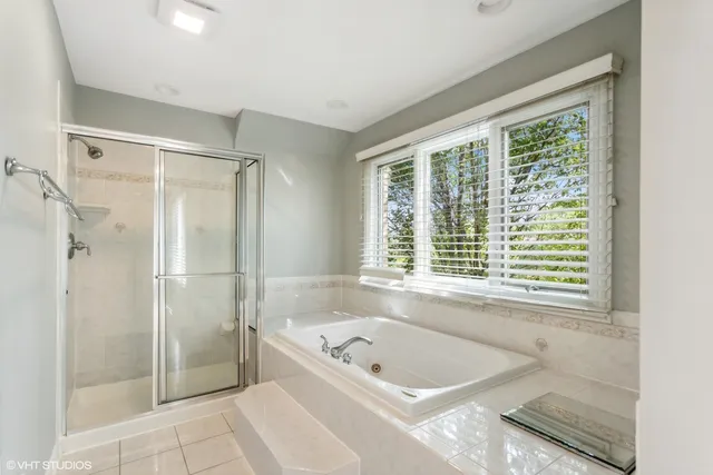 a bath tub sitting next to a window