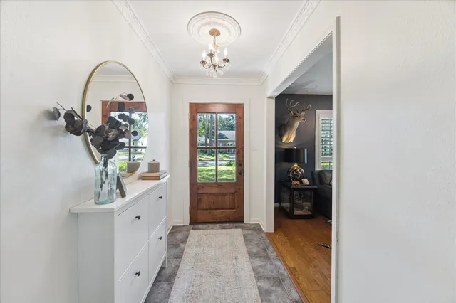 a view of an entryway with wooden floor
