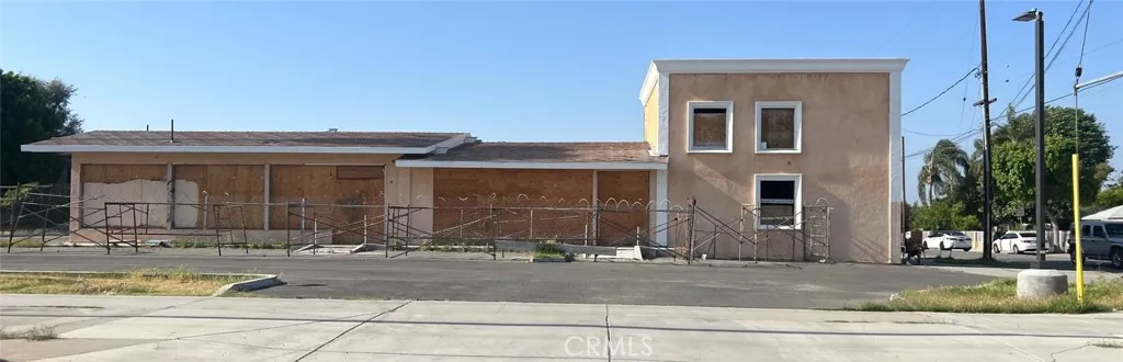 9005 Arlington Riverside, CA 92503 - Photo 1 of 1 a view of a white house with large windows and plants