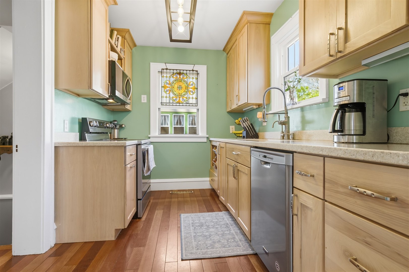 600 Normal Avenue Normal, IL 61761 - Photo 11 of 29 a kitchen with cabinets a window and stainless steel appliances