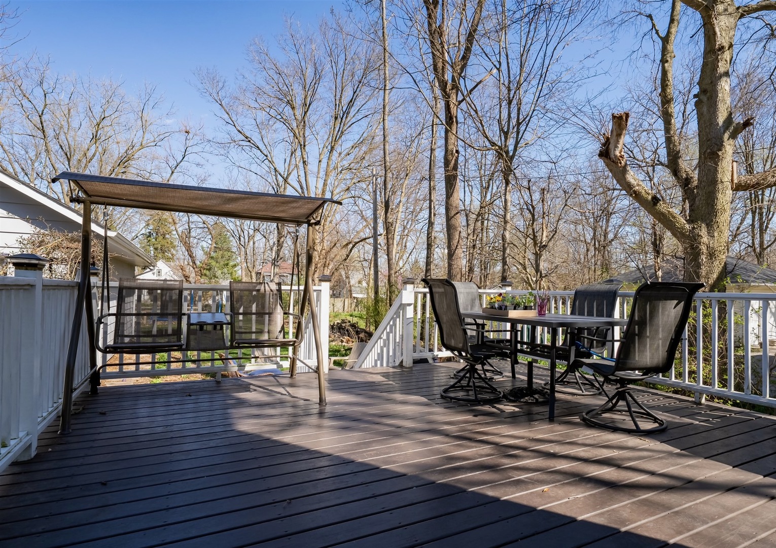 600 Normal Avenue Normal, IL 61761 - Photo 24 of 29 a view of a patio with table and chairs with wooden floor and fence