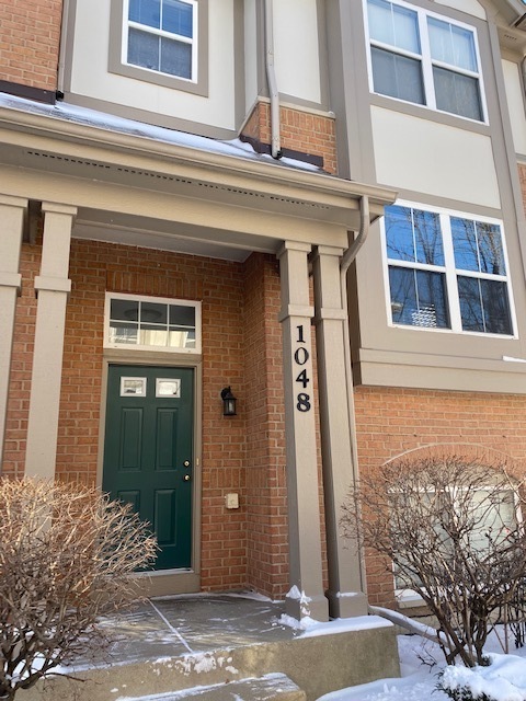 1048 North Claremont Drive Palatine, IL 60074 - Photo 1 of 5 a front view of a house