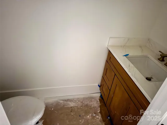 a bathroom with a sink and toilet