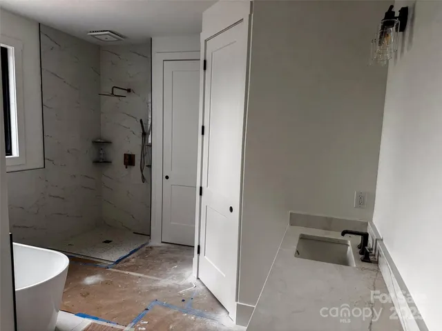 a bathroom with a shower and a toilet