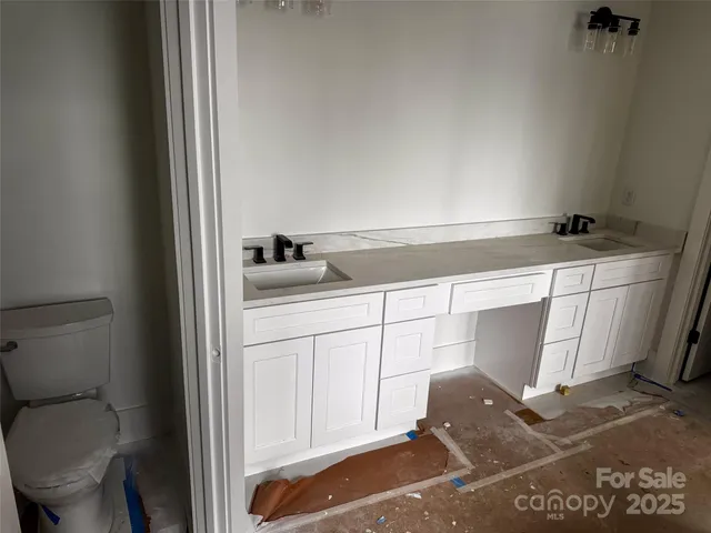 a kitchen with a sink and cabinets